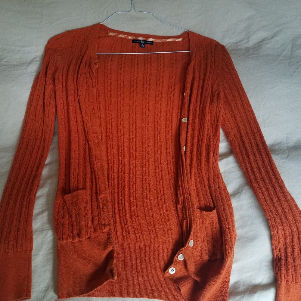 Bright orange cardigan